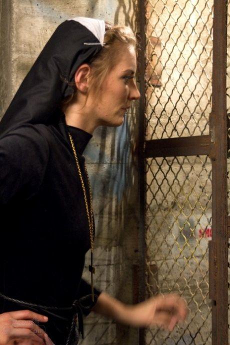 Brunette nun Audrey Noir gets punished &amp; finger fucked by sister Mona Wales (19).jpg